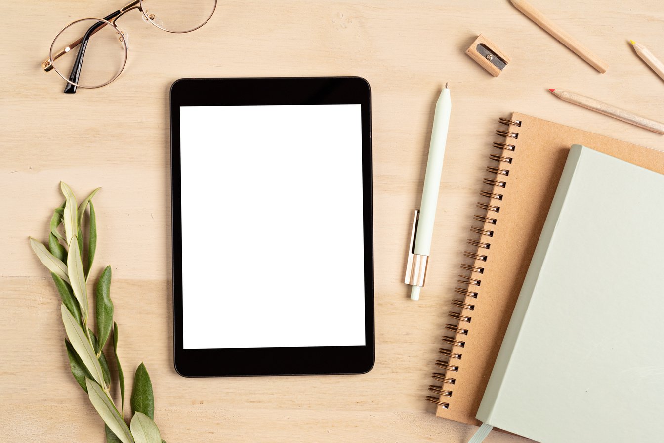 Tablet and Stationery on a Wooden Desk    