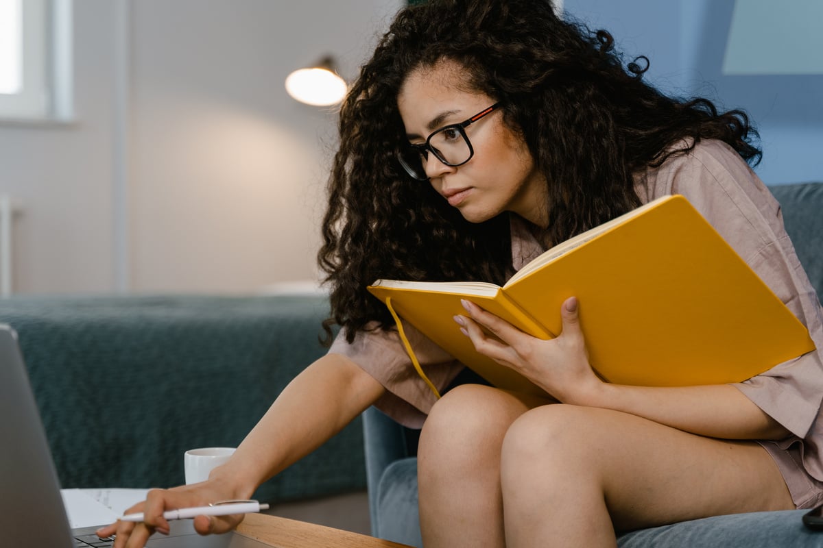 Woman Wearing Eyeglasses While Using Laptop